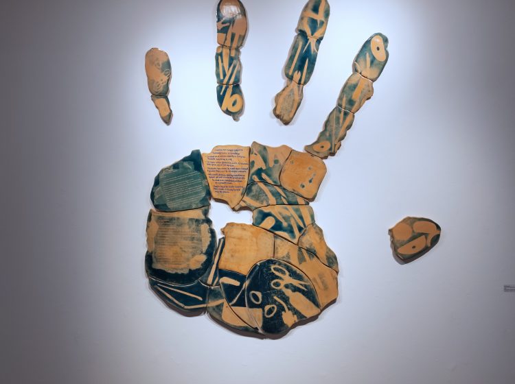 Self Portrait, I am what I make, use, and consume, Earthenware, electric fired to 955┬░c, cyanotype, rustoleum finish, 2026, 55.5_x 48_x 1.75_, Front Distance View